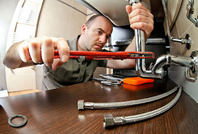 portrait of caucasian plumber at work; Shutterstock ID 129687008